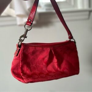 A beautiful red Coach purse